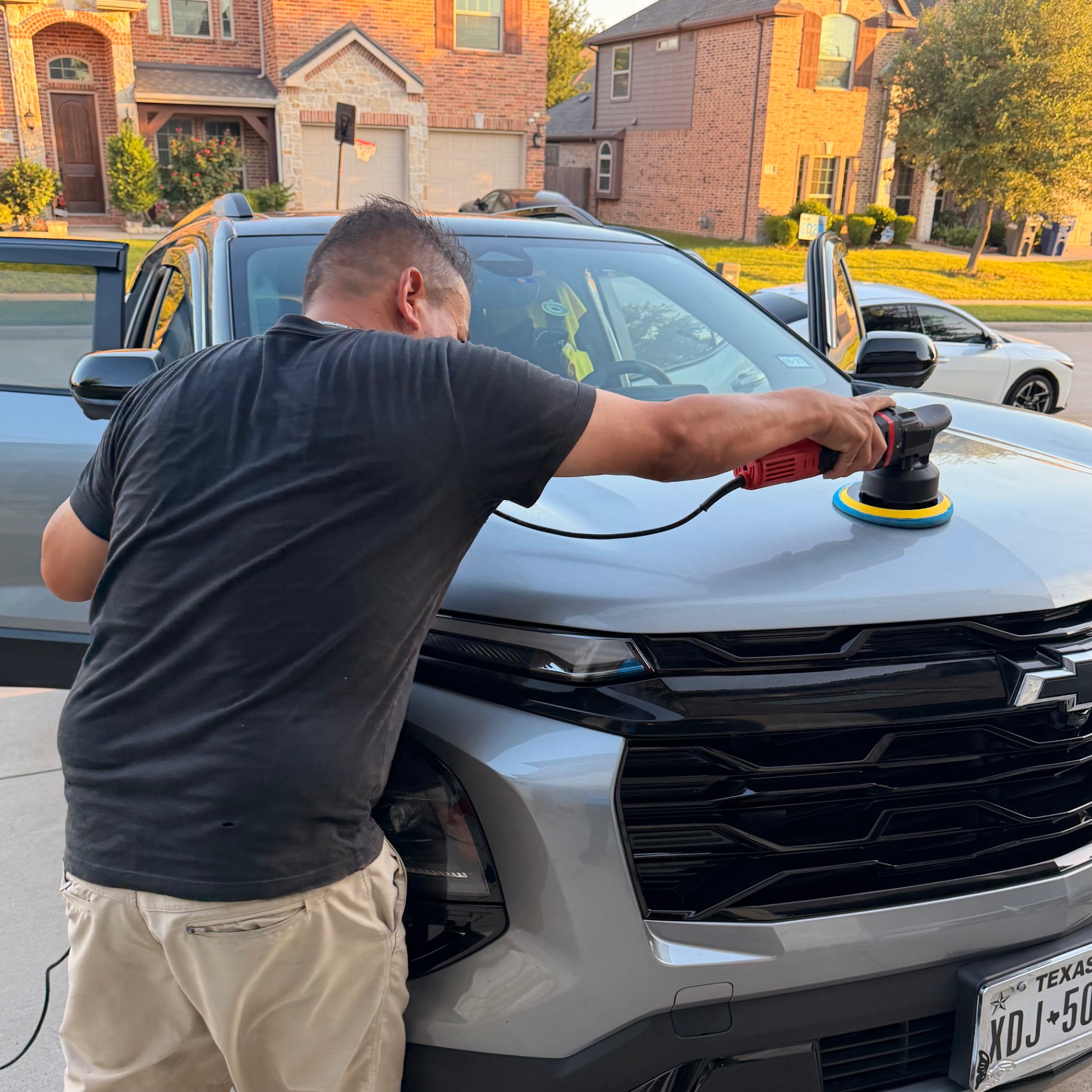 Machine buffing a Chevy Trax hood